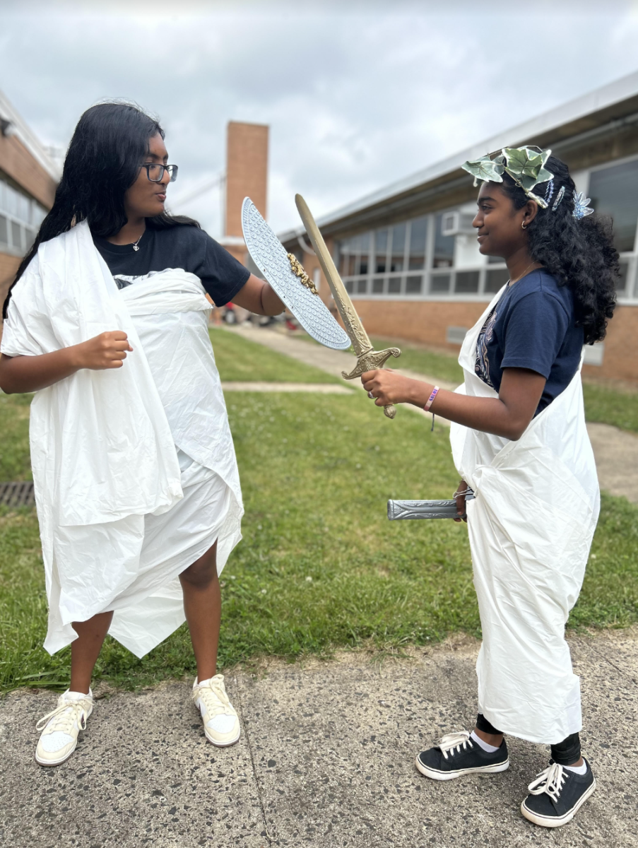 Rithika Gunasekaran 27 and Solai Ramasubramaniyam 27 reenacting a famous scene from the book, Song of Achilles by Madeline Miller, where protagonists Patroclus, the expelled prince, and Achilles, the fated best warrior train together.